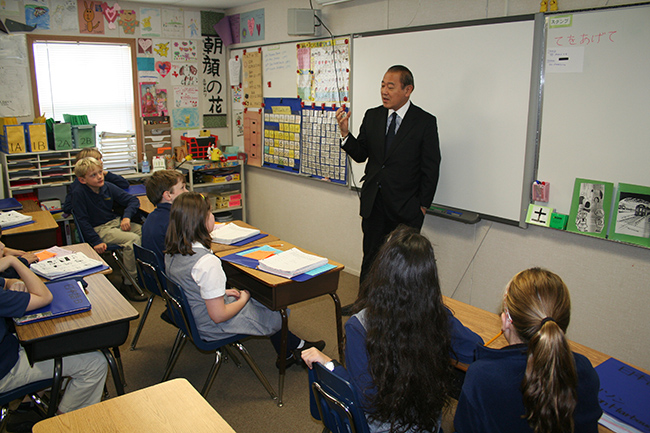 Picture of a modern classroom using a whiteboard Using whiteboard and board markers